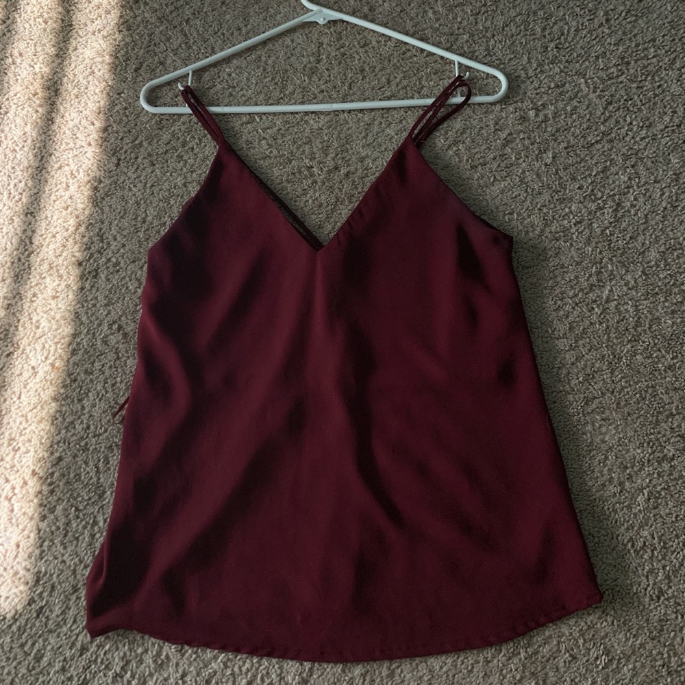 maroon blouse with cross strings in the back